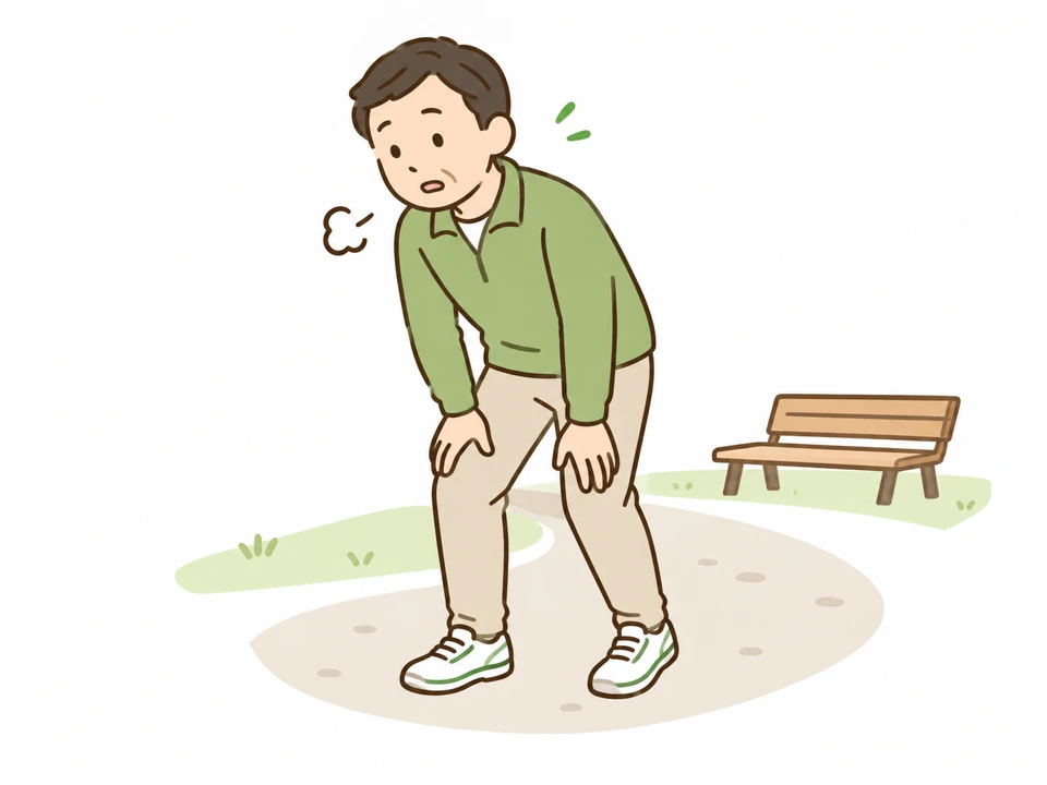 歩く途中で休憩する男性